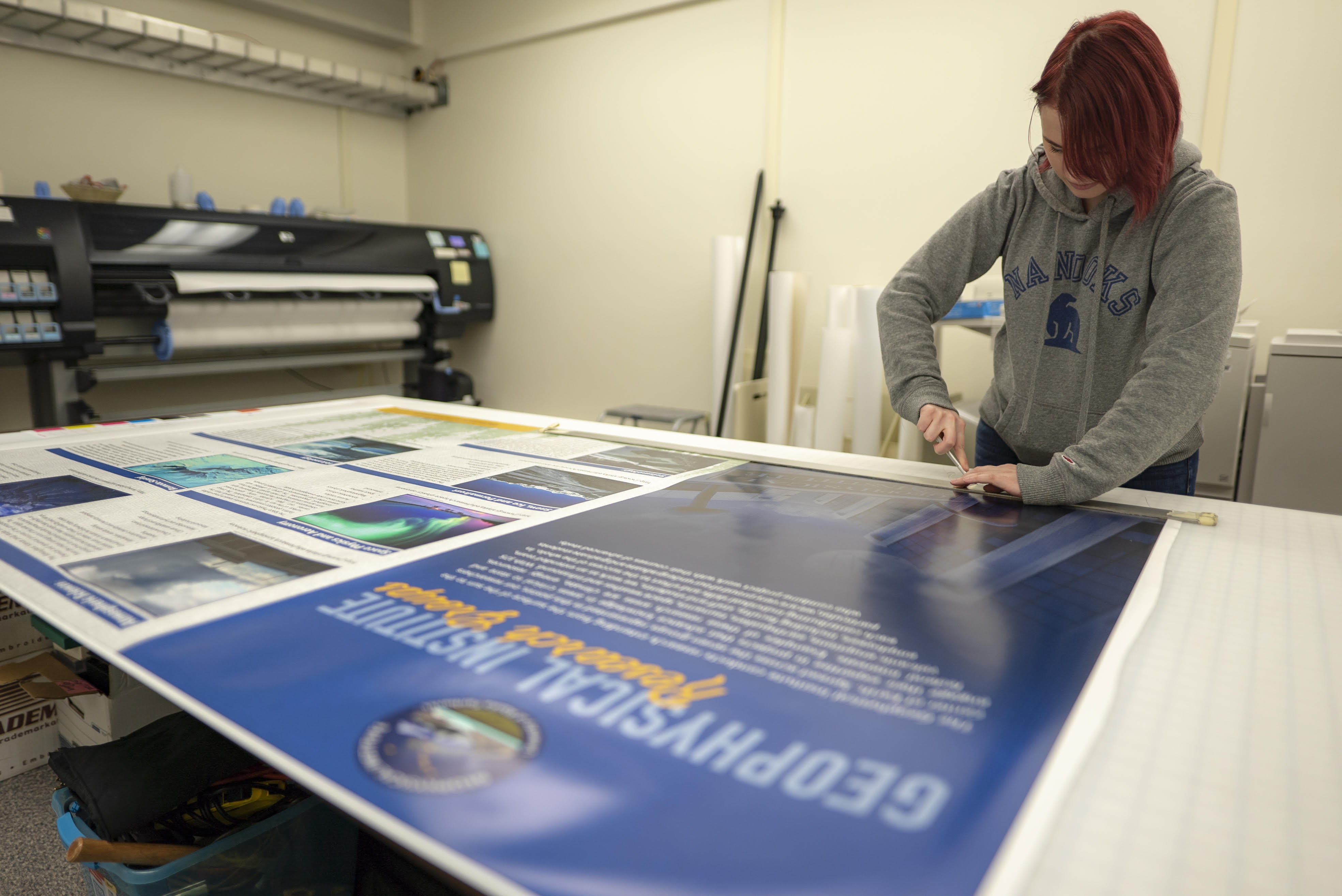GI poster being printed in Design Services