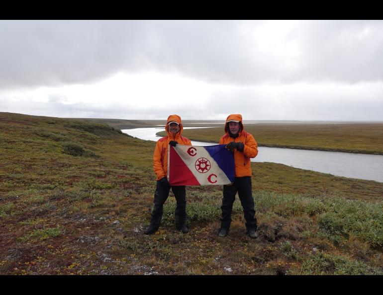 Anthony Fiorillo, left, and Paul McCarthy hold an Explorers Club banner during their Alaska research. Photo courtesy of Antony Fiorillo