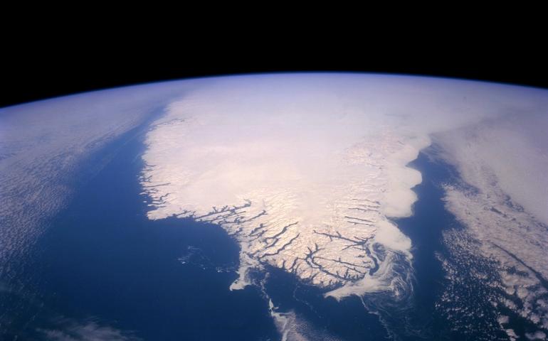 The Greenland Ice Sheet, shown here in June 2017, contains approximately 700,000 cubic miles of ice that would raise the global sea level by about 24 feet if it were to melt completely. Photo courtesy of NASA.